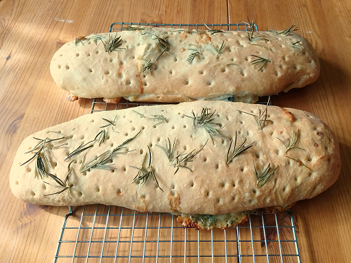 A pair of Stromboli: basil and black olive